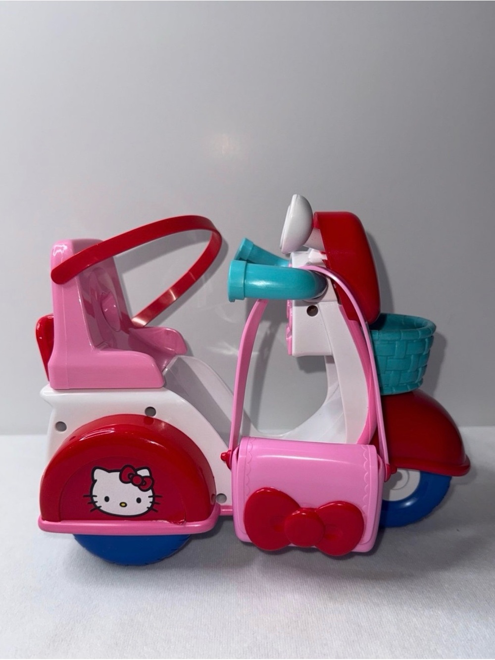 Hello Kitty Pink and Red Toy Scooter with Teal Accents